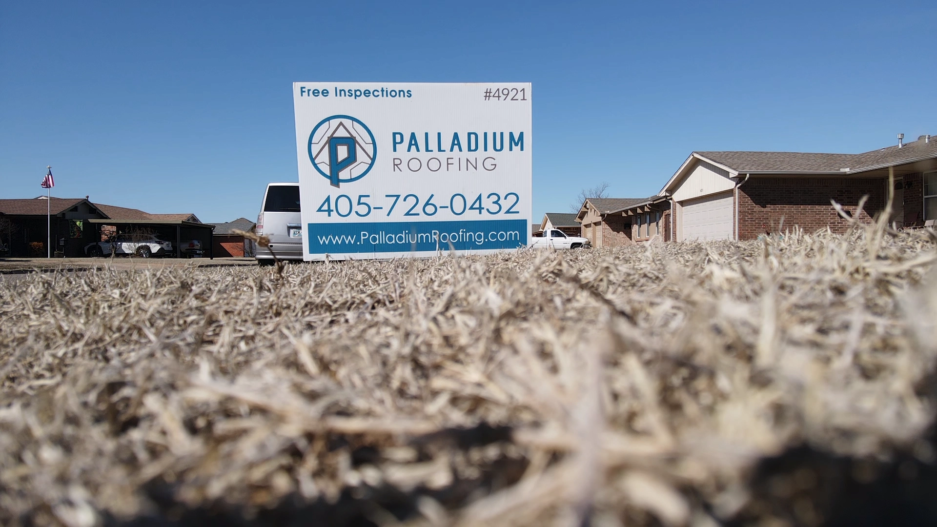 Palladium Roofing sign in yard