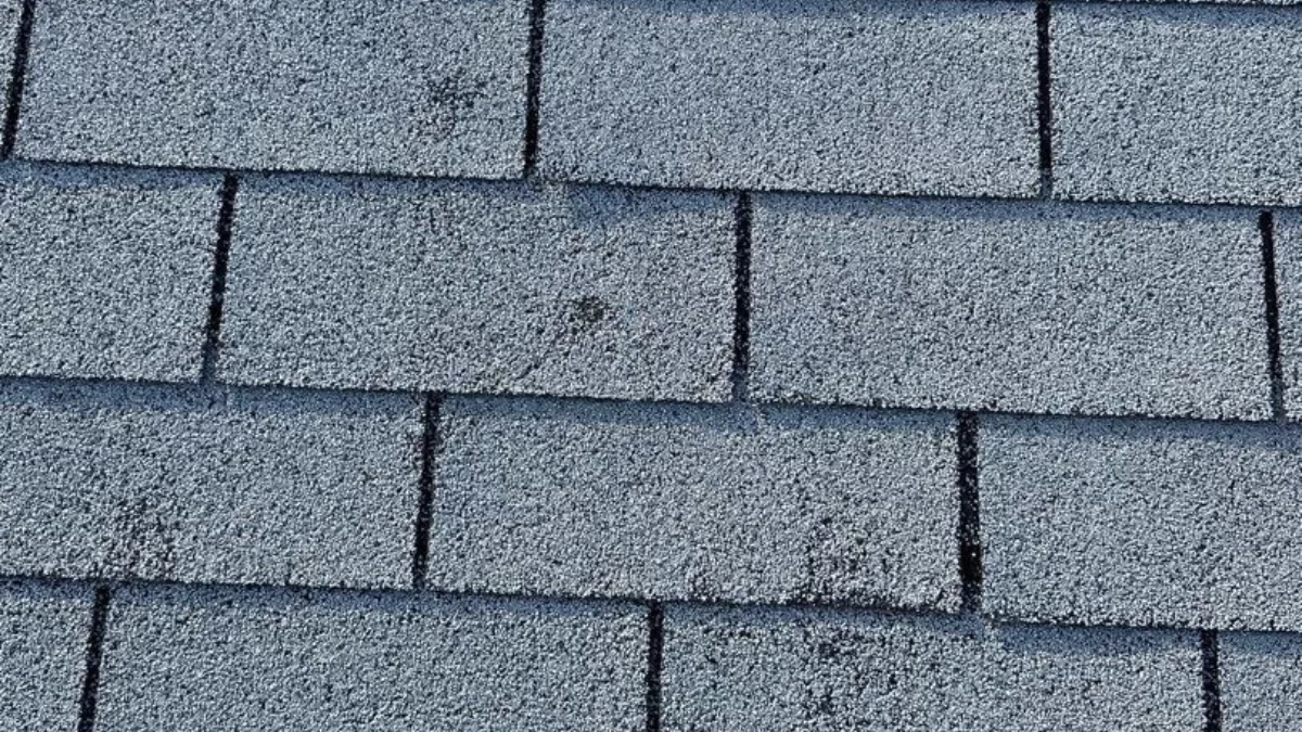 A roof exhibiting pre-loss conditions due to hail and storm damage