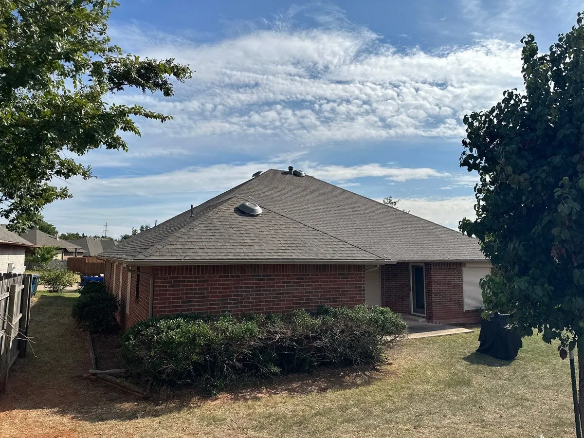 dark asphalt shingle roof of the house
