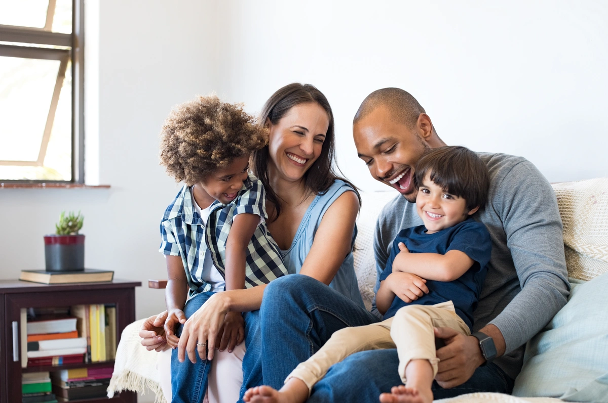 parents and their kids laughing together