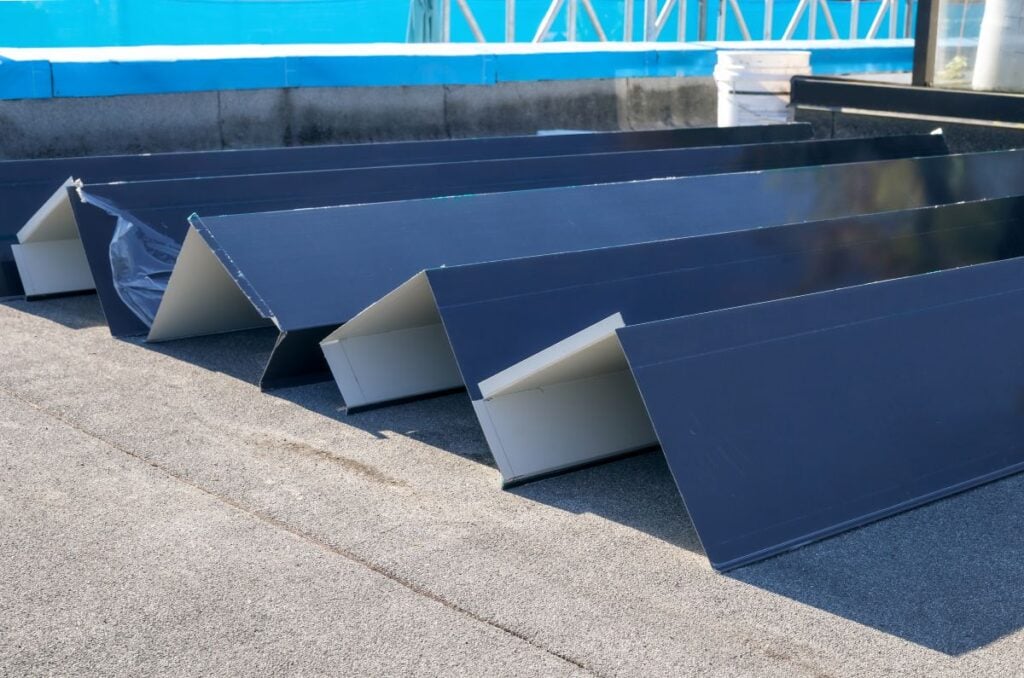 Roof metal flashing or coping installation. Custom sheet metal corners ready for installation