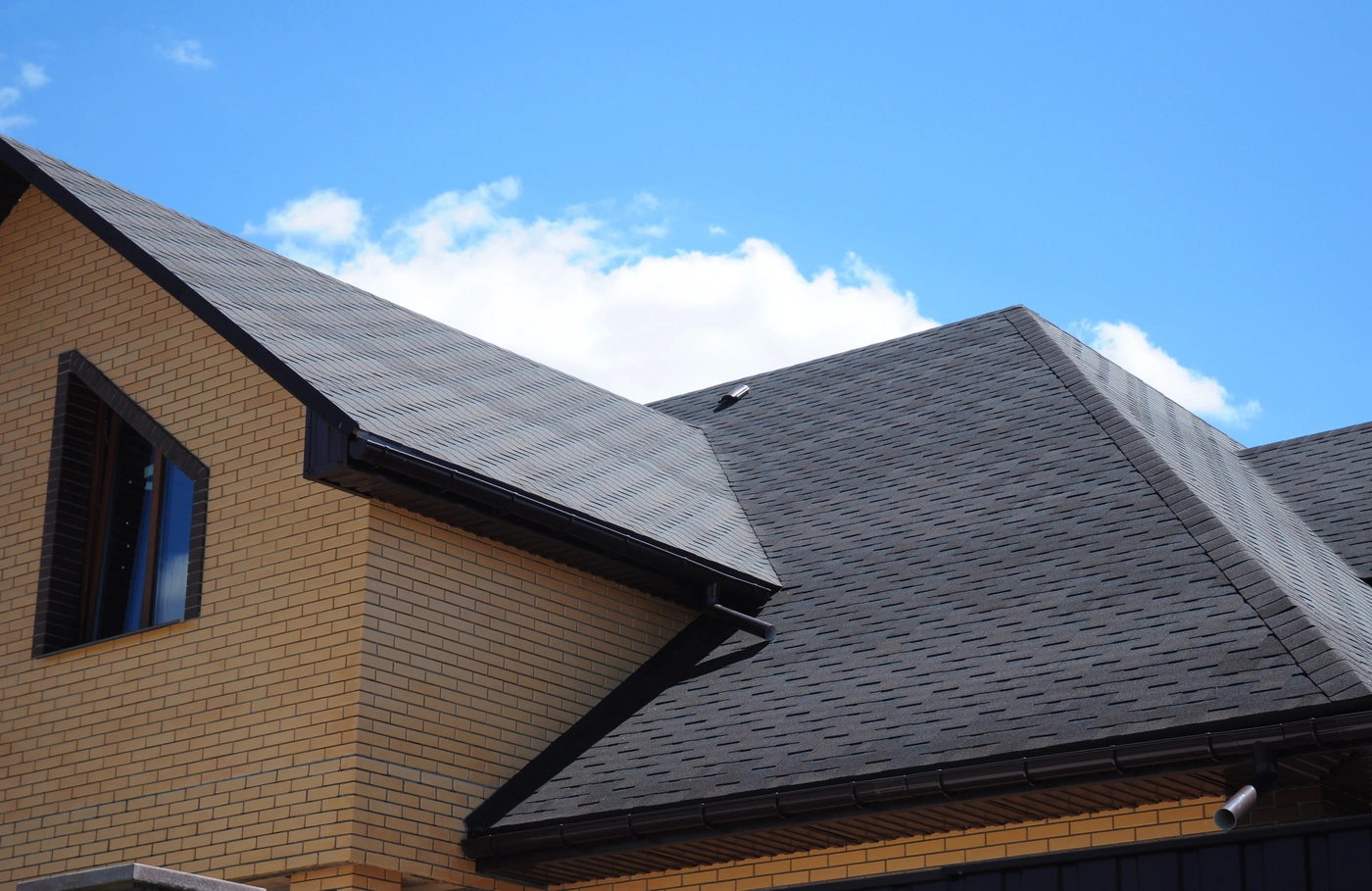 New roof installed on brick house in need of extreme storm damage roof repairs in Choctaw
