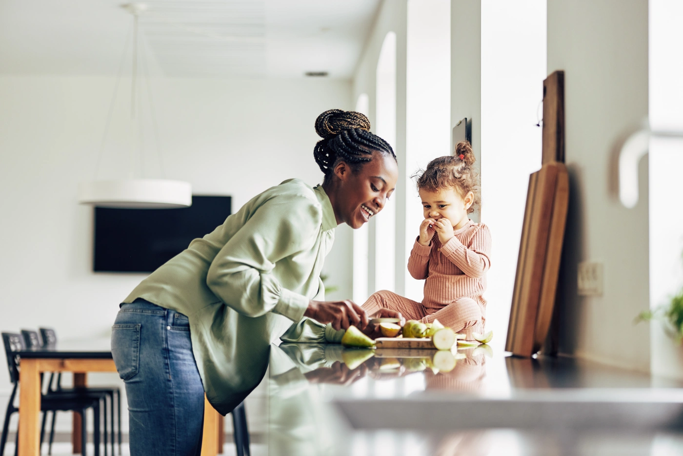 Happy mom and daughter in kitchen in Edmond OK home