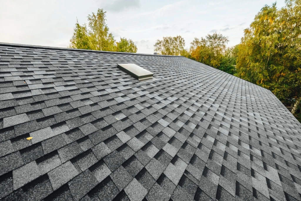 Architectural Shingles and 3 tab shingles on a house roof