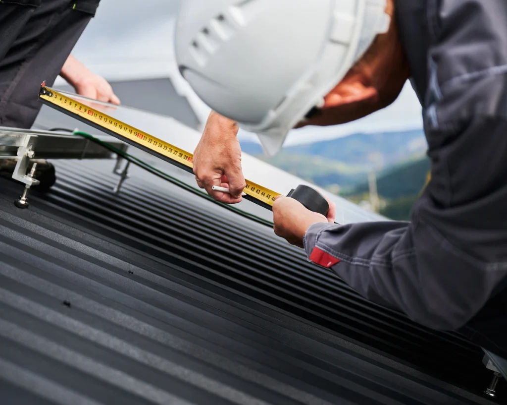 roofer measuring roof pitch