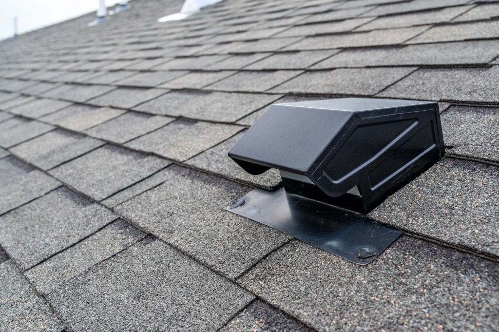 Close up view of box roof vent type on shingle roofing system