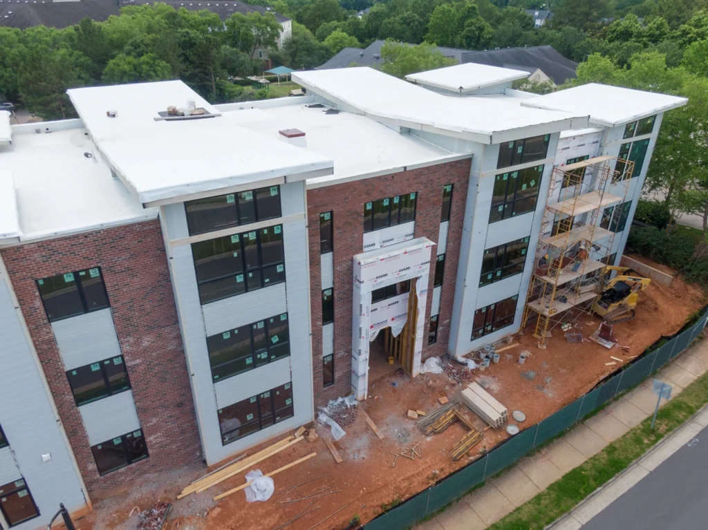 aerial view of new construction roofing installation with tpo roofing materials