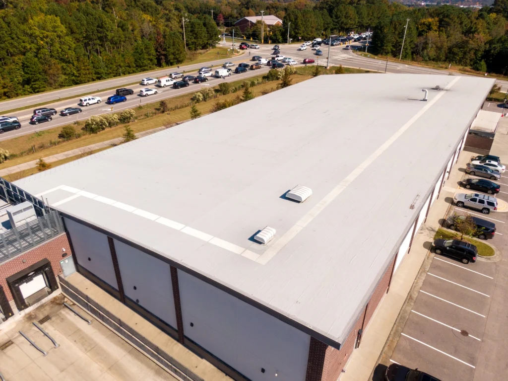 aerial view of white tpo roof installation installed at good cost for