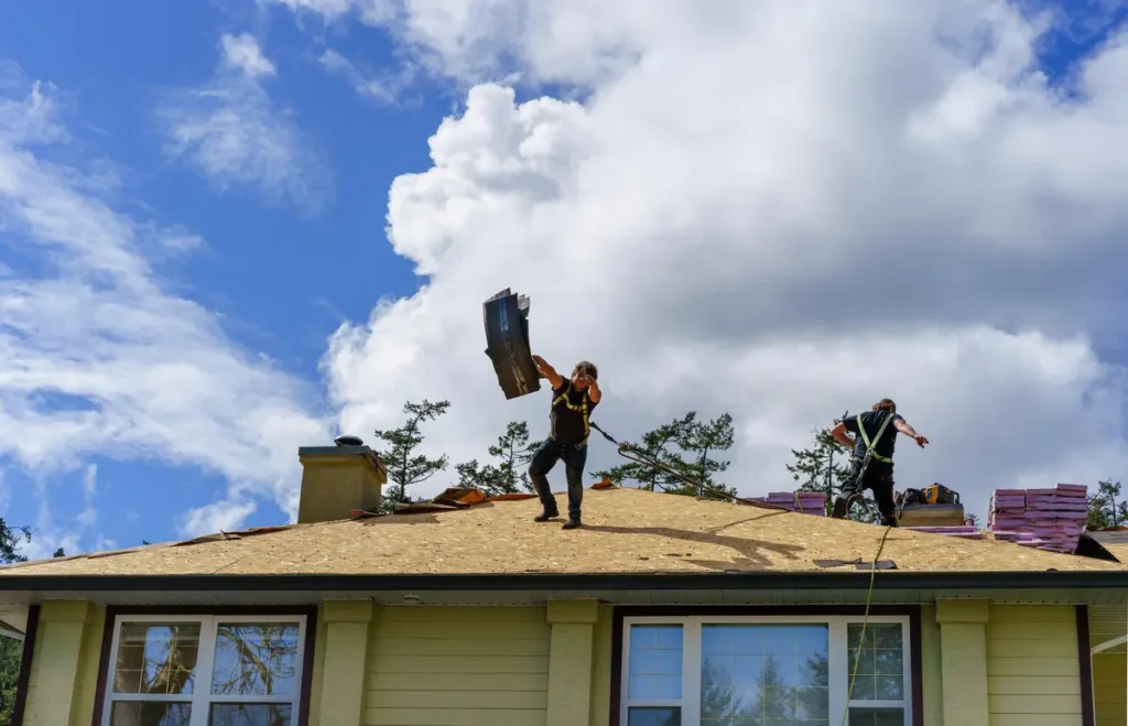 two roofers tear off