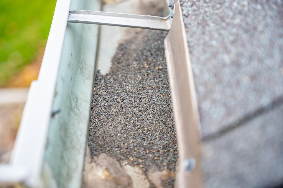 granule loss on shingles-granules collecting in gutter system