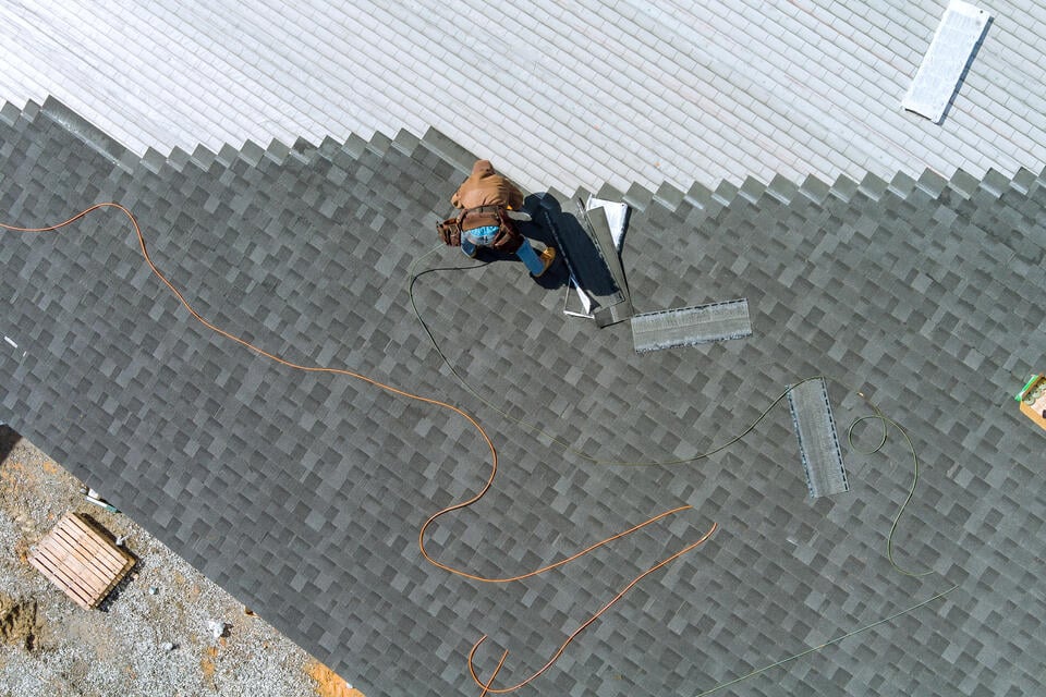 how to install architectural shingles-aerial view of roof tech installing architectural shingles on a house