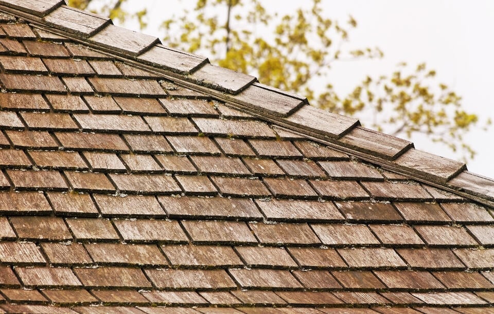 layers of a roof-wood shingles on a home