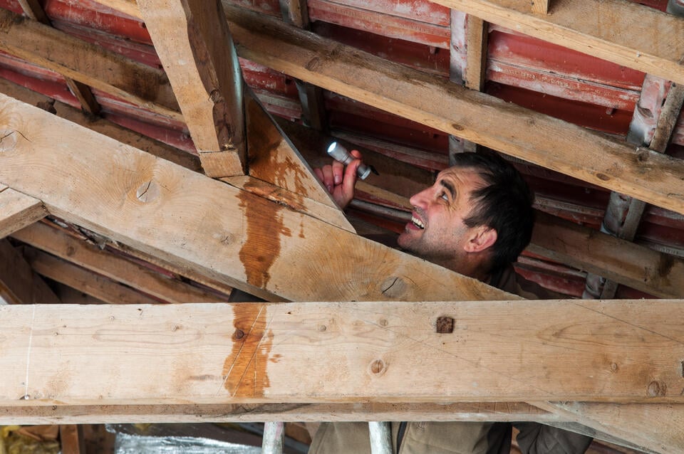 roof layers-roof inspector finds moisture in attic