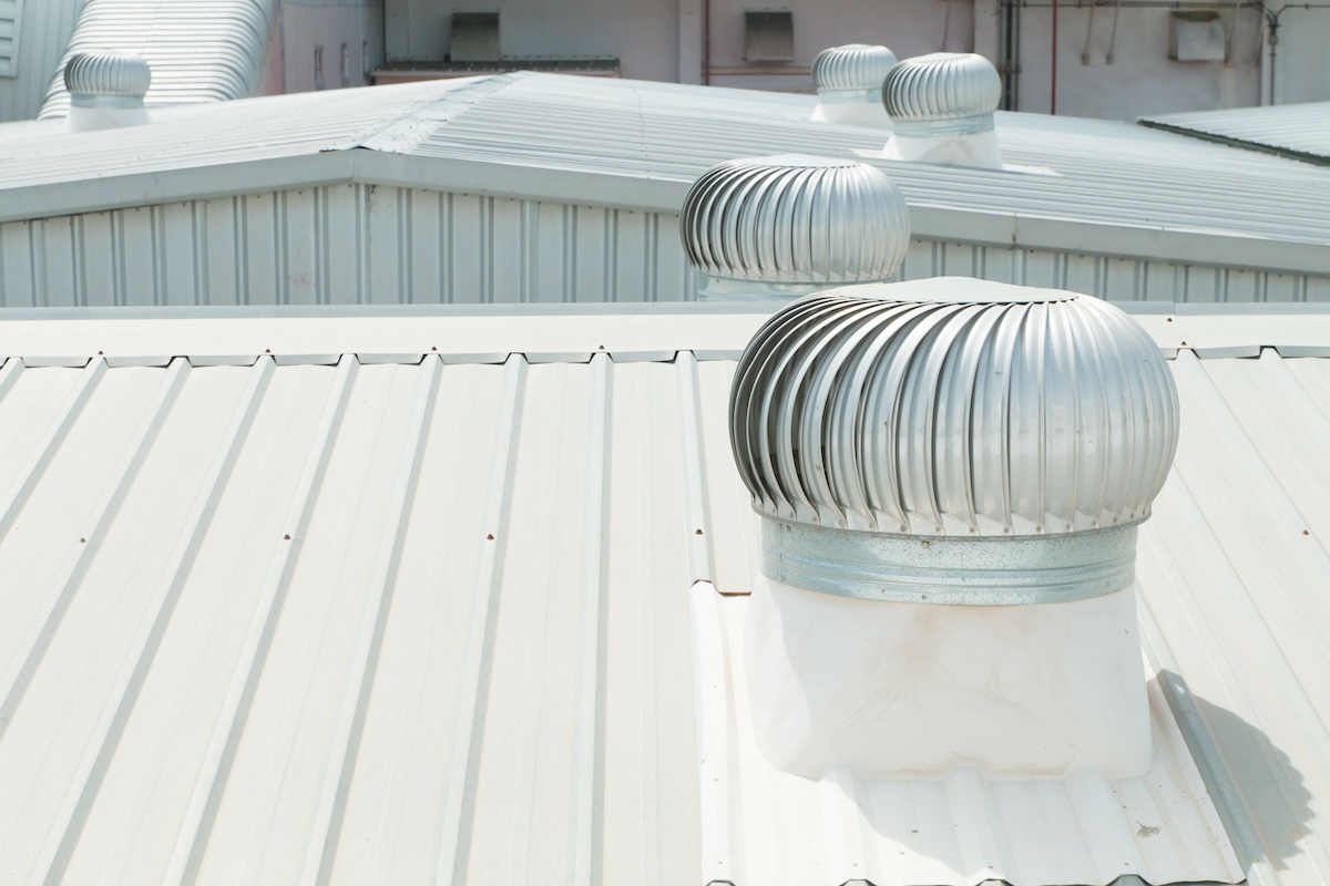 closeup white metal seam roof commercial roofing