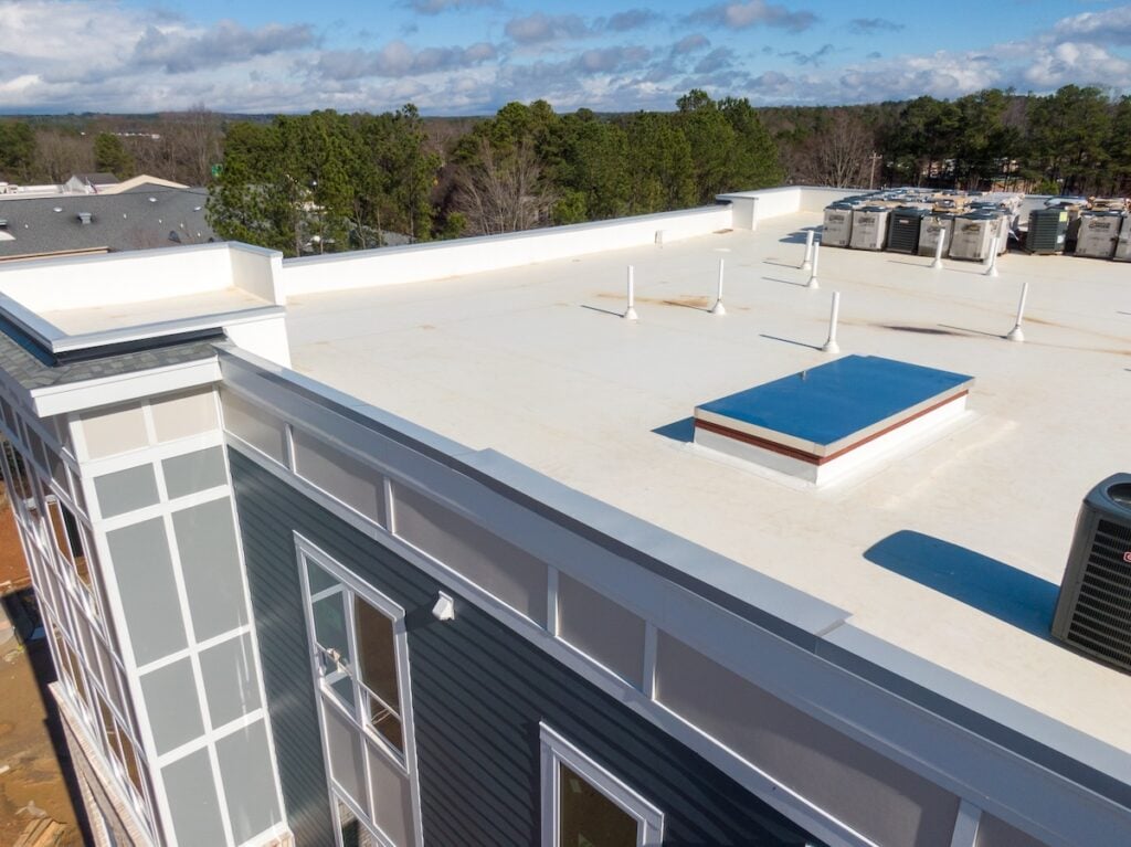 large white commercial roofing install