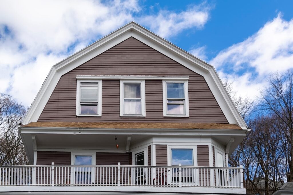 brown siding gambrel roof