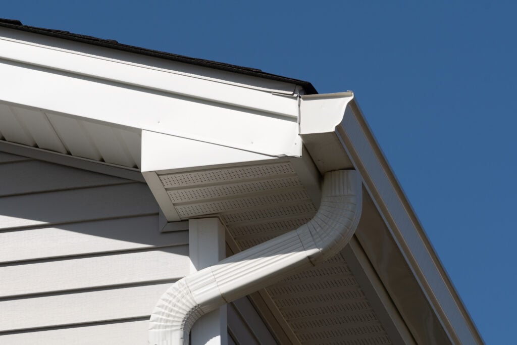 colonial white gutter guard system, fascia, drip edge, soffit providing ventilation to the attic roof line roof edge trim