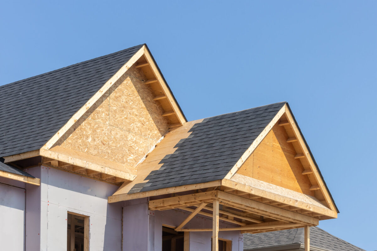 Dormers of a residential construction project showing plywood roof and oriented strand board or chip board dormer sheathing