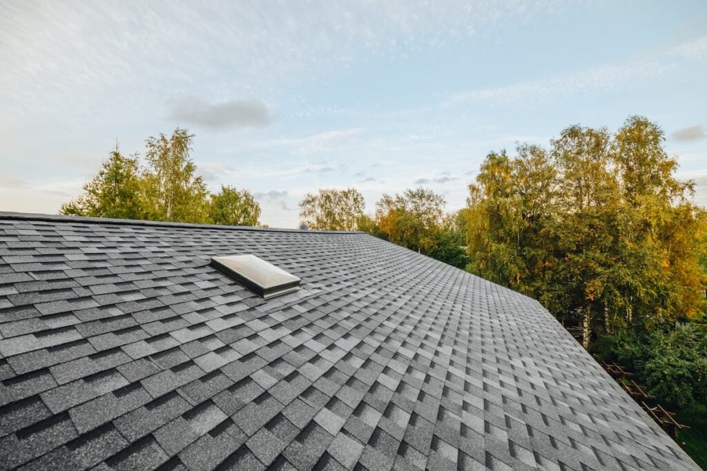 new renovated roof covered with asphalt roof shingles
