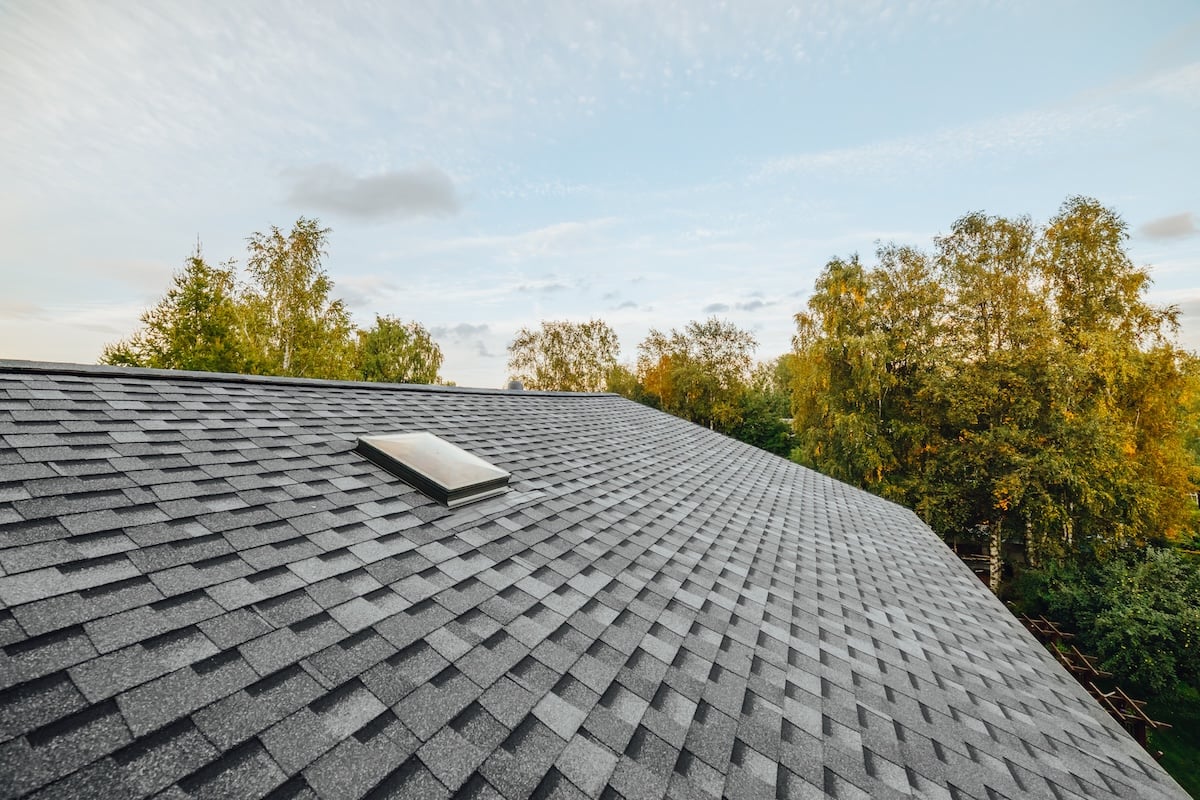 new renovated roof covered with asphalt roof shingles