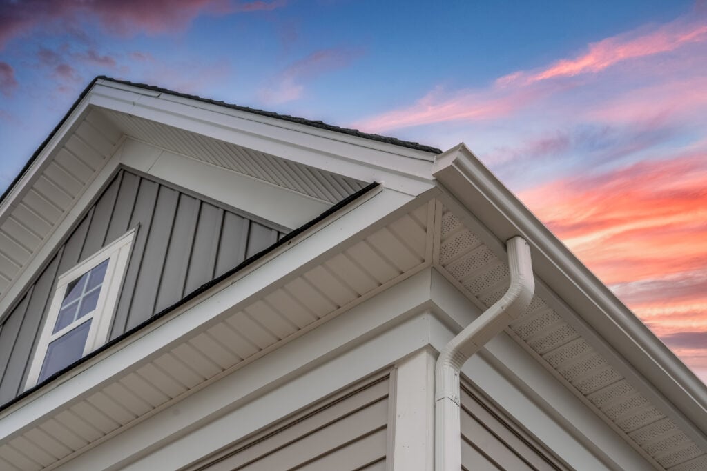 White frame gutter guard system, with gray horizontal and vertic