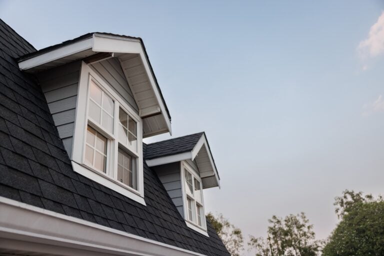 garret house with roof shingle in the evening time. wooden garret house and shingle tiles in the morning.