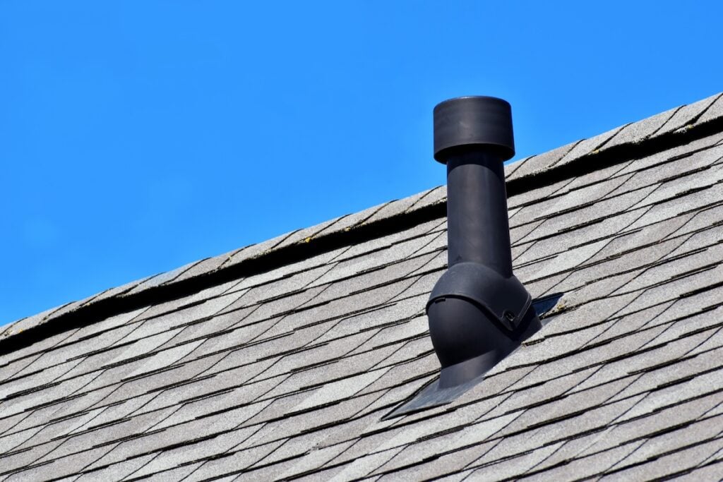 vent pipe flashing Old vent pipe flashing boot on roof of house. Roofing repair, home maintenance, and home inspection concept