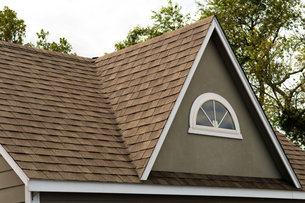 asphalt shingles roofing construction house rooftop. How much does a shingle roof cost?