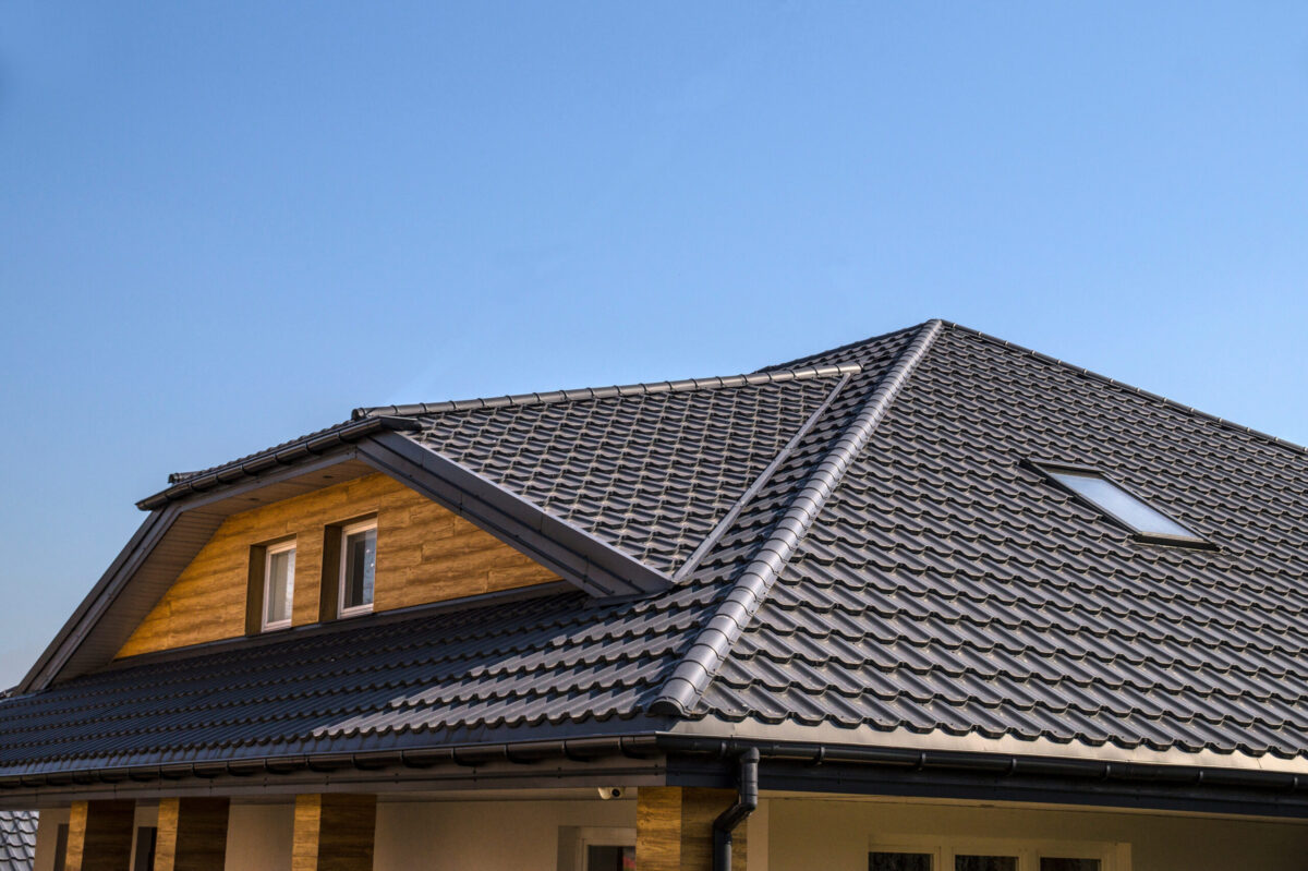 Interestingly solved roof surface. Roof made of metal roof tiles.