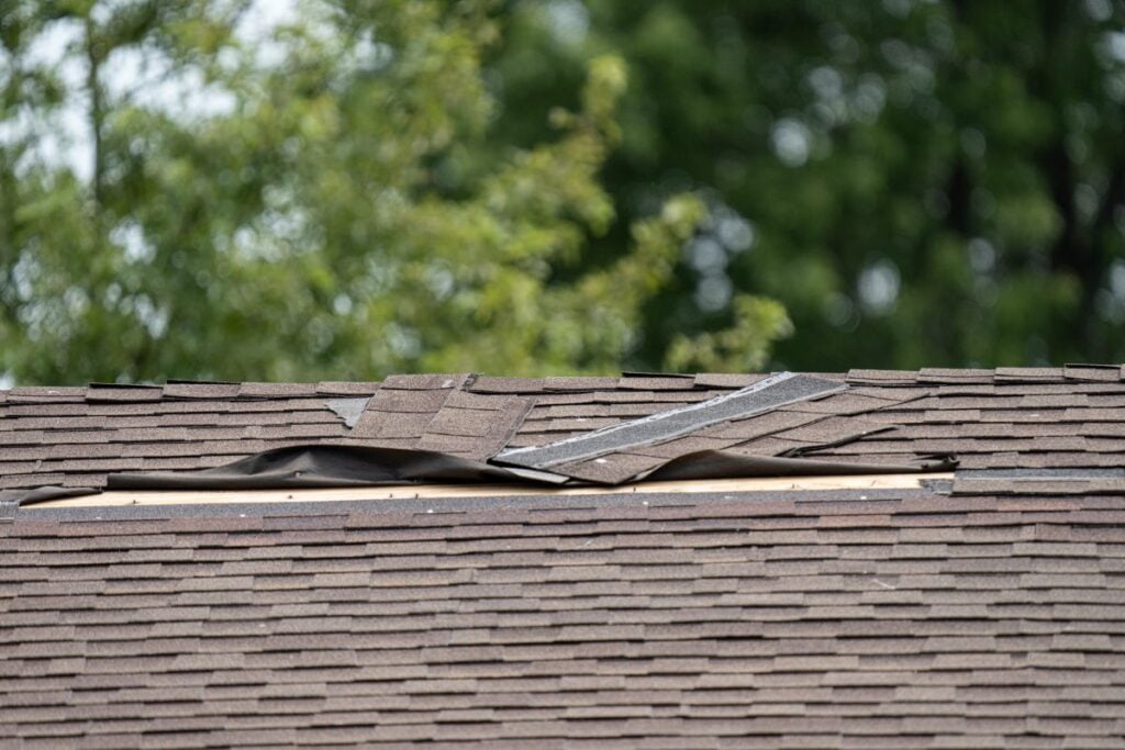 reliable roofers roof damaged by high winds and strong storms