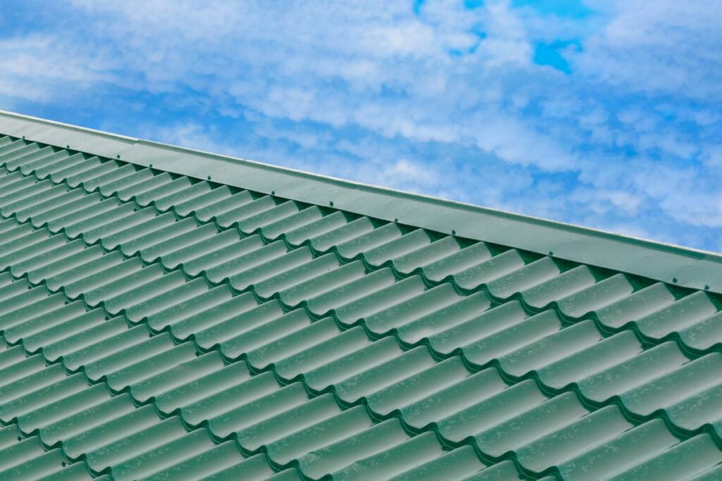 dark green metal shingles blue roof