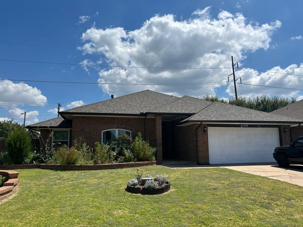 House with a new shingle roof by Palladium Roofing