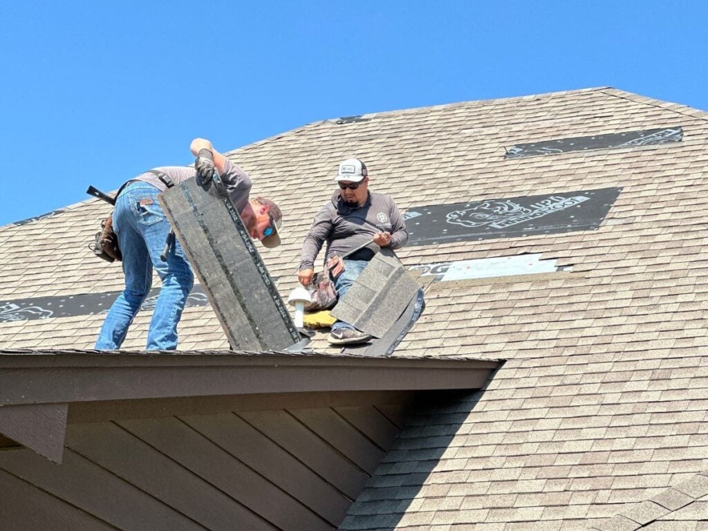 Palladium Roofing team repairing a shingle roof
