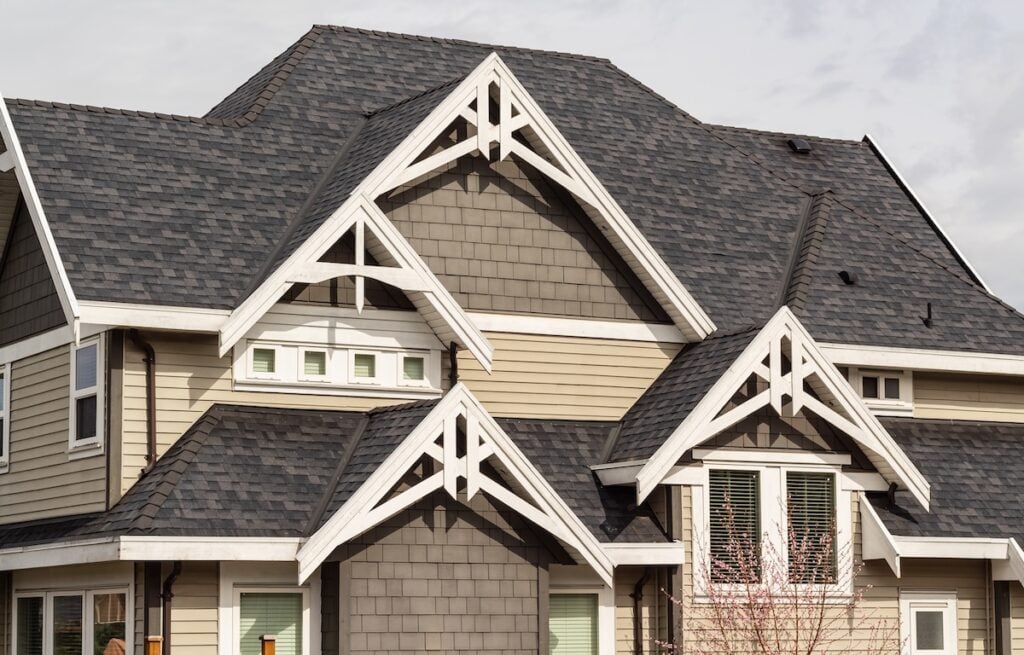 The roof of the house with details of exterior. Street view, nobody.