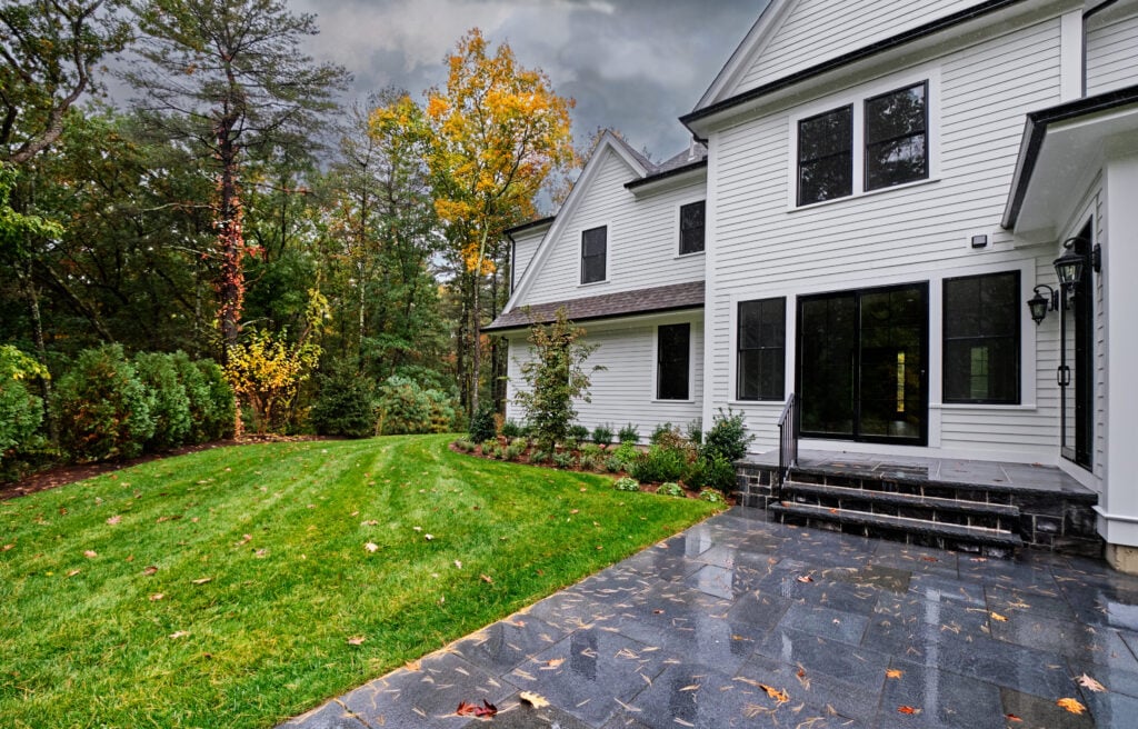 Autumn colors fade as a rainy breezy day soaks the back patio and garden