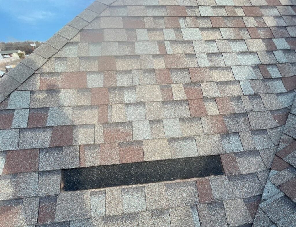 Storm damage on a roof, missing shingles